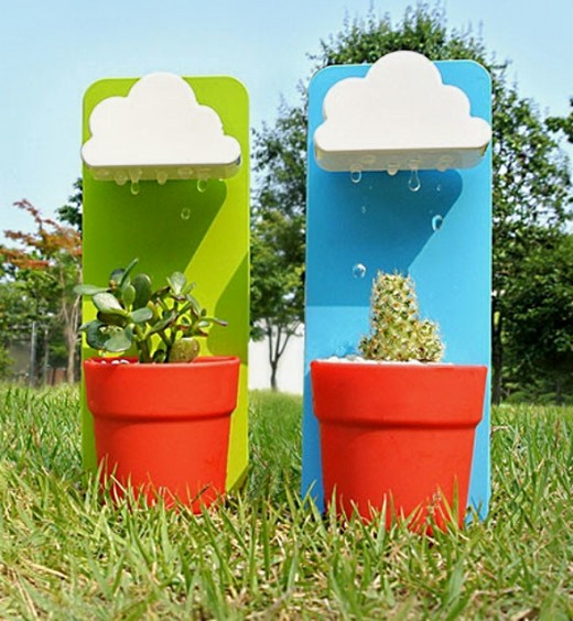 These rain cloud watering devices water the plants from artificial raindrops falling from the cloud reservoirs above the plants